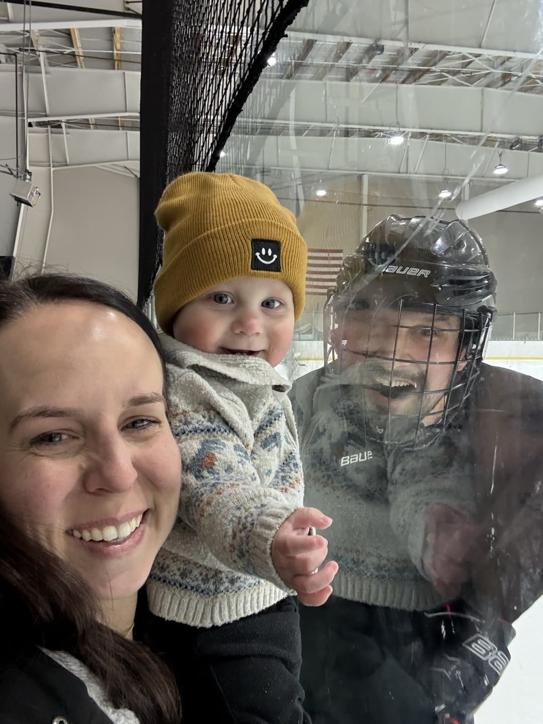 Cole and Amanda at the rink watching Josh play hockey