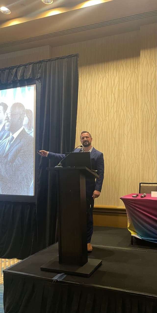 Joshua St. Laurent speaking at a conference